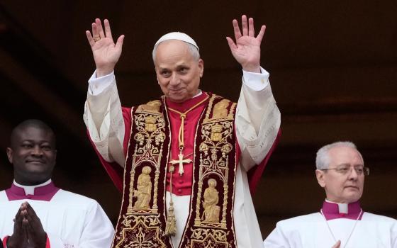 Pope Leo XIV waves after delivering the Urbi et Orbi (Latin for 'to the city and to the world' ) Christmas' day blessing from the main balcony of St. Peter's Basilica at the Vatican, Thursday, Dec. 25, 2025. (AP Photo/Gregorio Borgia)