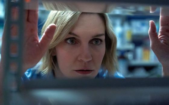 In Apple TV's "Pluribus," Rhea Seehorn plays Carol Sturka, a cranky author who is isolated after an alien virus "joins" the rest of humanity into a peaceful and content hive mind. (Apple TV)