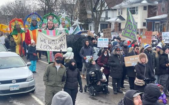 After an "ICE out of Minnesota" rally and march hosted by the Minnesota Immigrant Rights Action Committee Jan. 10, hundreds of participants marched to the site of the ICE shooting that killed Renee Good in Minneapolis Jan. 7. (Tim Montgomery)