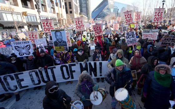 Thousands of protesters gathered Jan. 23 in downtown Minneapolis to oppose the Trump administration's aggressive immigration enforcement. Police arrested about 100 clergy demonstrating at Minneapolis-St. Paul International Airport. AP/Angelina Katsanis)