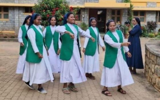 Sr. Soniya K. Chacko, a member of the Daughters of Charity of St. Vincent De Paul, appears with community members during a photo shoot in Vellanchira, Chalakudy, Kerala, southwestern India. The Rotary Club of Thiruvananthapuram selected her for its Digital Missionary Award of 2025, citing her courage, clarity and conviction in using social media to witness her faith. (George Kommattam)