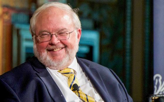 John Carr, founder of the Initiative on Catholic Social Thought and Public Life at Georgetown University, smiles during a panel discussion May 31, 2017, at the Jesuit-run university in Washington. (CNS/Georgetown University/Rafael Suanes)