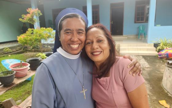 Sr. Fransiska Imakulata, of the Missionary Sisters Servants of the Holy Spirit, poses with abuse survivor Evi Bota Sao, at a shelter for women and children operated by the nongovernmental organization TRUK F, or the Flores Humanitarian Volunteer Team, in the city of Maumere in eastern Indonesia. (GSR photo/Chris Herlinger)