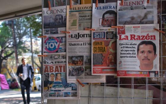 Newspapers hang on display for sale in Mexico City, Monday, Feb. 23, 2026, a day after the Mexican army killed Jalisco New Generation Cartel leader Nemesio Oseguera Cervantes, known as "El Mencho." (AP/Jon Orbach)