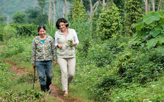 Heidi Kühn (right), founder of Roots of Peace, with a local farmer in Quang Tri, Vietnam, in 2020 (Courtesy of Thi Binh)