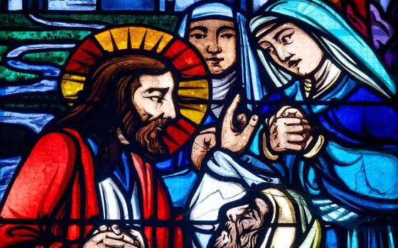 The raising of Lazarus, depicted in stained glass in a church in Orleans, France (Dreamstime/Pixelia21)