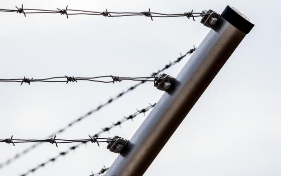 Barbed wire roping around a corner is shown in a close-up photo illustration. (Pixabay)