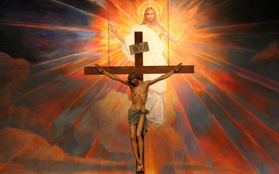 A crucifix hangs before a mural depicting the Resurrection in the sanctuary at St. Timothy Parish in Mesa, Ariz., in this undated file photo. (OSV News/Catholic Sun/J.D. Long-Garcia)