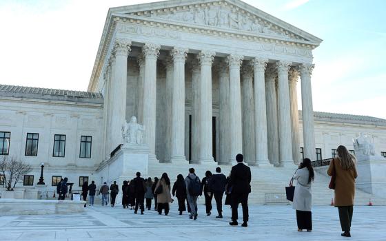 Visitors enter the U.S. Supreme Court building in Washington March 24, 2026. That day, a small group of clergy gathered for a vigil prior to arguments in Noem v. Al Otro Lado, a case to determine if noncitizens blocked on the Mexican side of the border by U.S. officials can apply for asylum. (OSV News/Reuters/Jonathan Ernst)
