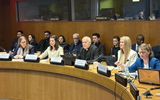 Archbishop Gabriele Caccia, the Vatican's permanent observer at the United Nations and newly appointed nuncio to the U.S. (center) speaks at a U.N. side event on women's health care March 18. He is surrounded by representatives from the Fertility Education and Medical Management Foundation and the Reproductive Health Research Institute. (NCR photo/Camillo Barone)