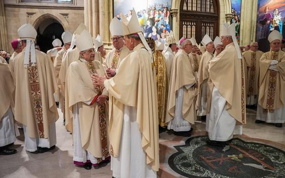 Bishops talk as they gather for the procession during the Installation Mass for New York Archbishop Ronald Hicks at St. Patrick's Cathedral in the Manhattan borough of New York on Feb. 6, 2026. (Pool Reuters via AP/Angelina Katsanis)