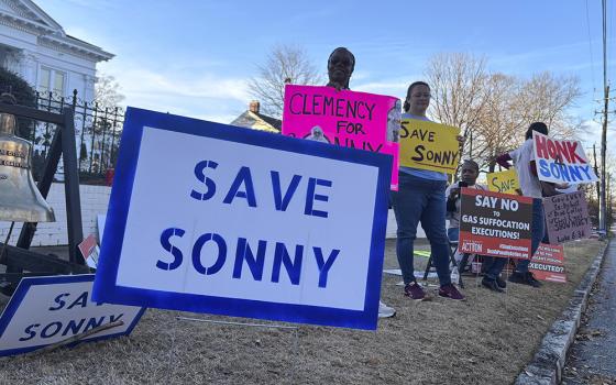 People gather outside the Alabama Governor's Mansion in Montgomery, Alabama, on Feb. 16, 2026, to urge Gov. Kay Ivey to grant clemency to Sonny Burton, who is scheduled to be executed on March 12, 2026. (AP photo/Kim Chandler)