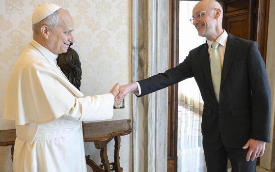 Pope Leo XIV shakes hands with author and journalist Gareth Gore at the Vatican March 16, 2026. (Courtesy of Gareth Gore/Vatican Media)