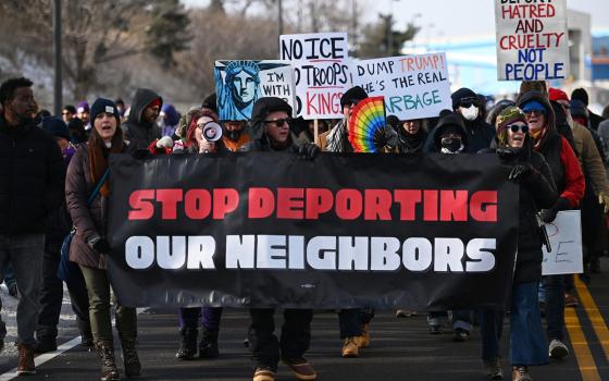 Protesters gather at a rally for immigrants and workers outside Signature Aviation near the Minneapolis-St.Paul International Airport, Dec 3, 2025, in Minneapolis. (AP Photo/Tom Baker)