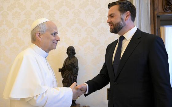 Pope Leo XIV shakes hands with U.S. Vice President JD Vance in the library of the Apostolic Palace at the Vatican May 19, 2025. (CNS/Vatican Media)