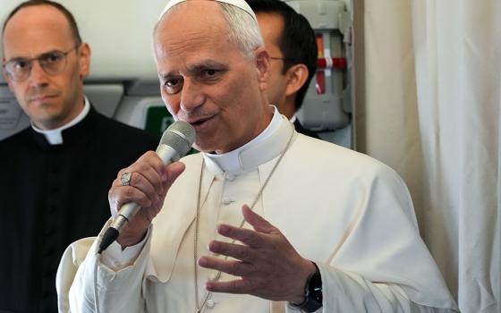 Pope Leo XIV answers questions from journalists during a news conference aboard the plane flying back to Rome after leaving Equatorial Guinea, April 23, 2026. (CNS/Lola Gomez)