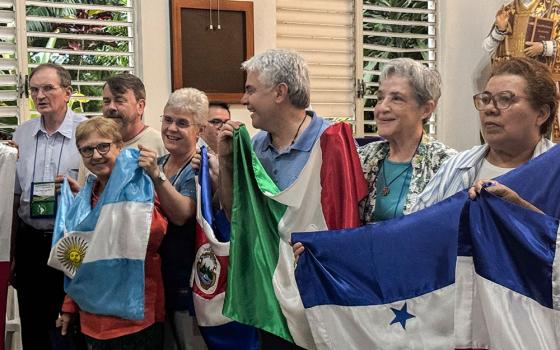 Members of the Confederation of Latin American and Caribbean Religious hold flags from various Latin American countries as they sing in a chapel during a board meeting March 21, 2026, in the Dominican Republic. CLAR affirmed its commitment to the process that Pope Francis called "walking together," or synodality. (GSR photo/Rhina Guidos)