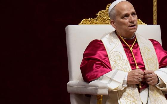 Pope Leo XIV leads a vigil for peace inside St. Peter's Basilica at the Vatican, April 11. After praying the rosary, Leo addressed world leaders in his call for peace. (AP/Gregorio Borgia)