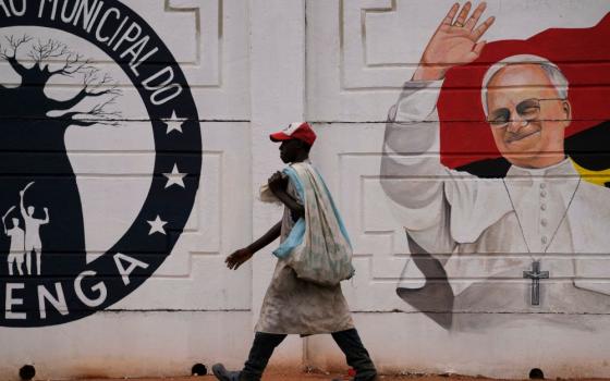 A man walks past a mural of Pope Leo XIV in Luanda, South Africa, April 16, 2026. Leo is expected to pray the rosary April 19 at the Church of Our Lady of Muxima in Angola as part of his11-day Africa tour. (AP/Themba Hadebe