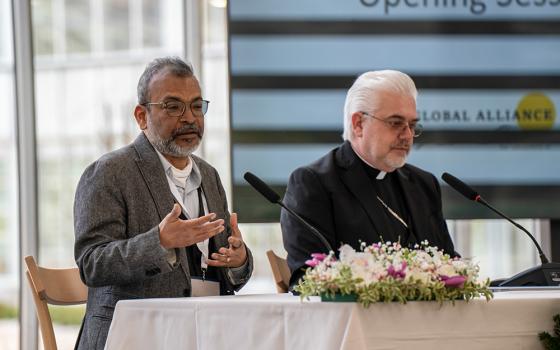 Arun Agrawal, left, a professor of sustainable development at the University of Notre Dame, speaks during a session of the first gathering of the Global Alliance on Laudato Si' held March 9-10, 2026, at Borgo Laudato Si' in Castel Gandolfo, Italy. Seated next to Agrawal is Cardinal Fabio Baggio, director of the Vatican's Laudato Si' Center for Higher Education. (Allesandro Sgarito)