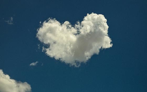 Cloud in the shape of a heart against a blue sky (Unsplash/Remi Clinton)