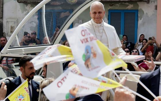 Pope Leo XIV rides on his popemobile during his one-day pastoral visit in Acerra, Italy, May 23, 2026. (AP/Salvatore Laporta)