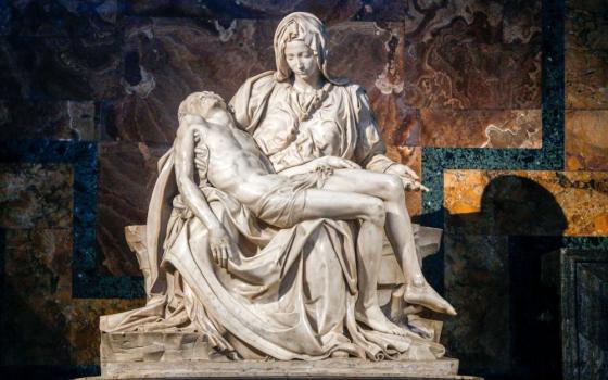 In 1972, a man took a hammer to Michelangelo's Pietà in St. Peter's Basilica, breaking the Renaissance sculpture into at least 100 pieces. A team repaired the sculpture, which is now protected by bulletproof and shatterproof glass. (CNS/Lola Gomez)