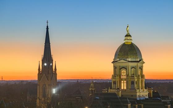 The sun sets over the main building and Basilica of the Sacred Heart steeple on the campus of the University of Notre Dame in South Bend, Indiana, Nov. 23, 2025. (OSV News/Courtesy University of Notre Dame/Matt Cashore)