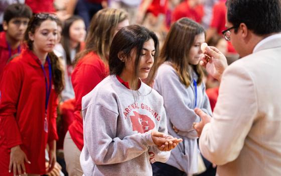 A file photo shows students at Cardinal Gibbons High School in Fort Lauderdale, Fla., receiving Communion during a Mass and rally for the opening of the school year. (OSV News/Tom Tracy)