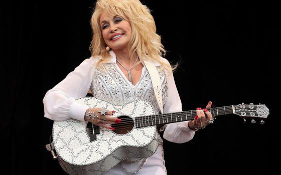 American country music star Dolly Parton performs on the Pyramid Stage at Worthy Farm in Somerset, England, during the Glastonbury Festival June 29, 2014. Parton, 80, died Aug. 25, 2026, after a brief battle with cancer. (OSV News/Reuters/Cathal McNaughton)