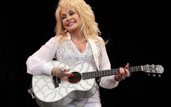 American country music star Dolly Parton performs on the Pyramid Stage at Worthy Farm in Somerset, England, during the Glastonbury Festival June 29, 2014. Parton, 80, died Aug. 25, 2026, after a brief battle with cancer. (OSV News/Reuters/Cathal McNaughton)