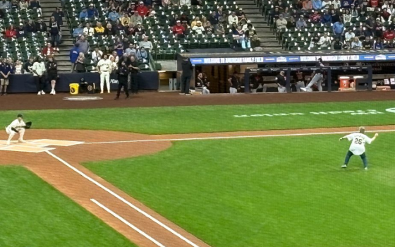 Sr. Debra Sciano throws out the ceremonial first pitch at a Milwaukee Brewers game June 17. Sciano, who will become president of the Leadership Conference of Women Religious Aug. 1, is such a big baseball fan she keeps score during games on a paper scorecard. (Courtesy of Kathy Sciano Lamb)