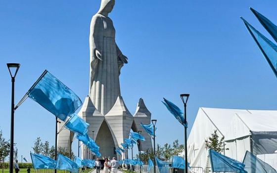 People walk inside an enormous statue of the Virgin Mary that is believed to be Europe's tallest during the inauguration in the village Konotopie, Poland, Aug. 15, 2026. (AP/Claudia Ciobanu)