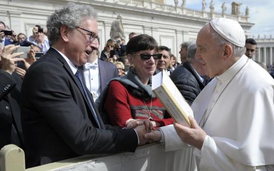 Amy-Jill Levine, center, and Marc Zvi Brettler present Pope Francis with "The Jewish Annotated New Testament" during his weekly general audience March 27, 2019. Levine is the first Jewish president of the Catholic Biblical Association of America. (CNS/Vatican Media)