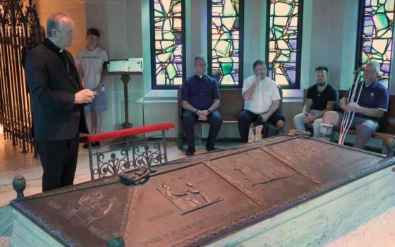 Irish Archbishop Eamon Martin of Armagh prays near the tomb of Venerable Fr. Edward Flanagan, founder of Boys Town, at Dowd Memorial Chapel of the Immaculate Conception in Omaha July 16, 2026. The parish serves the village of Boys Town. (OSV News/The Catholic Voice/Riley Johnson)