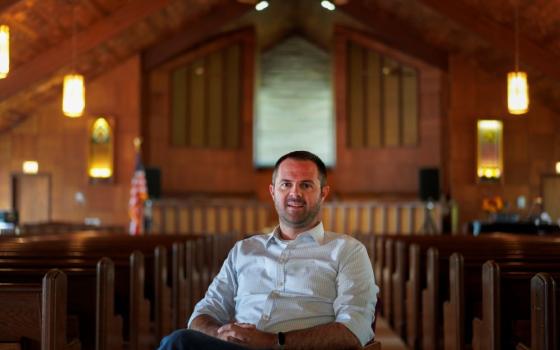 Ryan Burge, a sociologist, professor at the John C. Danforth Center on Religion and Politics at Washington University, and author of "The Vanishing Church," poses for a portrait at First Baptist Church in Mount Vernon, Ill., Sept. 10, 2023. (AP/Jessie Wardarski)