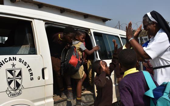 St. Anthony Children's Village program manager Dominican Sr. Bernadette Mwita welcomes pre and primary school children. The Dominican Missionary Sisters of the Sacred Heart of Jesus manage St. Anthony Children's Village in Ndola, Zambia. (Derrick Silimina)