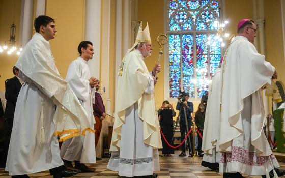 Archbishop Paul Richard Gallagher, center, the Holy See's secretary for relations with states, celebrates a Mass at the Cathedral of the Immaculate Conception in Moscow Aug. 27, 2026. (AP/Pavel Bednyakov)