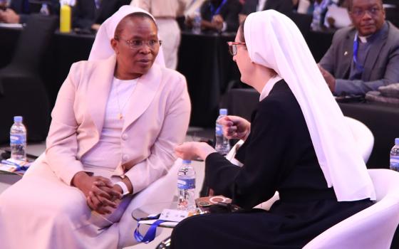 Sr. Nina Krapić, deputy director of the Holy See Press Office, right, speaks to Sr. Jane Wakahiu, associate vice president of the Catholic Sisters Initiative at the Conrad N. Hilton Foundation. Both were speakers at the SIGNIS World Congress, Aug. 1-8 in Kigali, Rwanda. (Courtesy of Sr. Rocio Garcia)