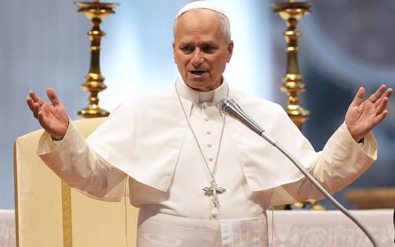 Pope Leo XIV delivers a blessing in St. Peter's Basilica, on the occasion of the weekly general audience at the Vatican Aug. 5, 2026. (AP Photo/Gregorio Borgia)