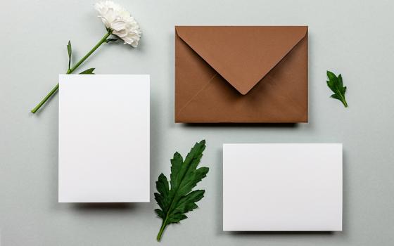 Three envelopes with a flower and two leaves (Unsplash/Razvan Dumitrasconiu)