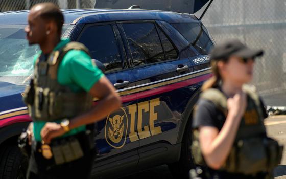 U.S. Immigration and Customs Enforcement agents stand guard, as ICE and federal agents secure the entrance to the Delaney Hall detention center while demonstrators gathered outside in Newark, New Jersey, May 29, 2026. (OSV News/Reuters/Eduardo Munoz)