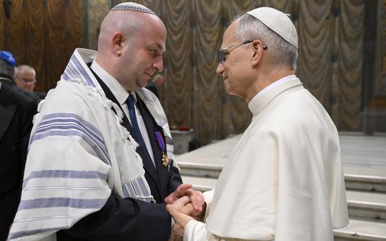 Pope Leo XIV greets Silviu Vexler, president of the Federation of Jewish Communities in Romania, during a ceremony honoring Blessed Iuliu Hossu in the Sistine Chapel at the Vatican June 2, 2025. (CNS/Vatican Media)