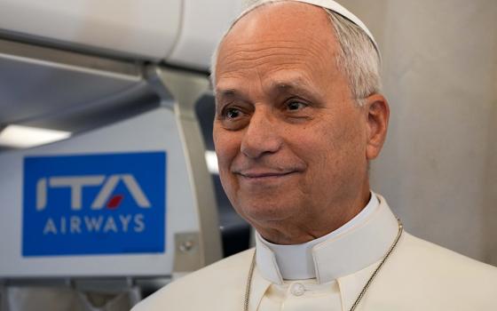 Pope Leo XIV speaks to journalists aboard the papal flight from Rome to Paris Sept. 25, 2026, at the start of his apostolic journey to France and visit to UNESCO. (CNS/Lola Gomez)