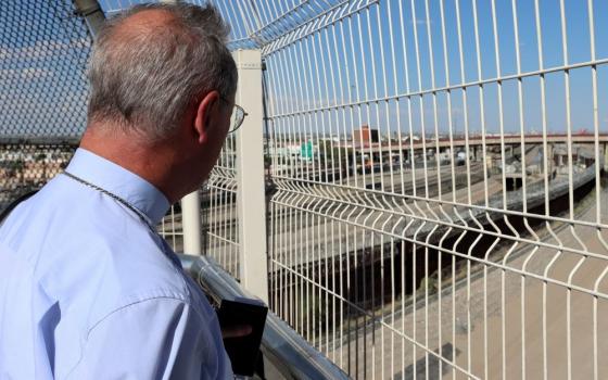Archbishop Stefan Hesse of Hamburg, who is the special representative for refugee issues for the German Bishops' Conference, looks through the U.S-Mexico border fence Aug. 25, 2026, after returning from Ciudad Juárez, Mexico, to El Paso, Texas. (OSV News/Courtesy German Bishops Conference//Daniela Elpers)