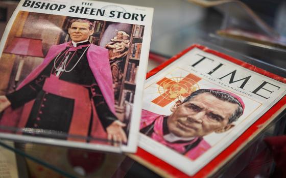 Publications featuring the late Archbishop Fulton Sheen are displayed among other artifacts and memorabilia at the Sheen Museum on July 15, 2026, in Peoria, Ill. (AP/Jessie Wardarski)