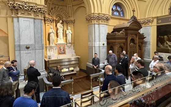 Catholic pilgrims, including LGBTQ Catholics, clergy, religious, family members and others pray at the altar dedicated to victims of HIV/AIDS at St. Francis Xavier Church in New York City, Sept. 26. (NCR photo/Camillo Barone)
