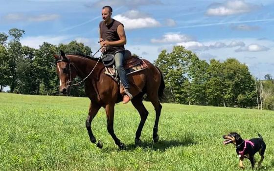 Maxwell Kuzma rides a horse on the Ohio farm where he makes his home. As this year's Season of Creation nears an end, Kuzma reflects on the invitation to pay attention to our interconnection with the natural world. (Courtesy of Maxwell Kuzma)