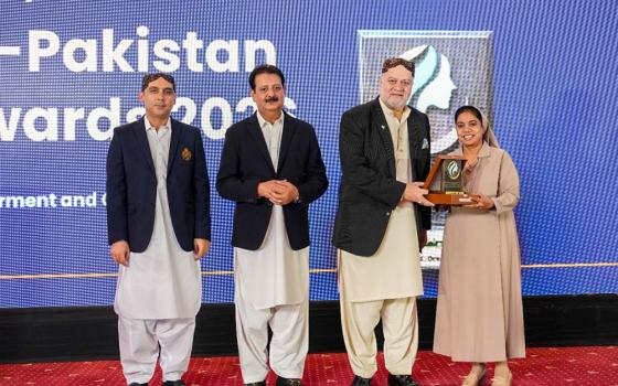 Sr. Mariam Gill receives an award from Pakistan's federal minister for poverty alleviation and social safety, Syed Imran Ahmed Shah, on Oct. 14, 2026, in Islamabad. (Courtesy of Christopher Sharaf)
