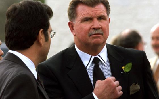 Former Chicago Bears coach Mike Ditka pauses to talk with the media following a private memorial service for the late Chicago Bears running back Walter Payton Nov. 5, 1999. Ditka, who was open about his Catholic faith, died on Oct. 9, 2026, at 86. (OSV News/Reuters/Sue Ogrocki)
